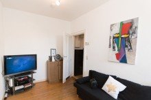 Wohnzimmer Gut vermietete, sanierte Jugendstilwohnung im Rheingauviertel zu verkaufen!