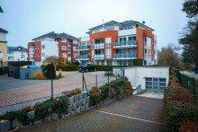 Tiefgarageneinfahrt Gut vermietete, barrierefreie Eigentumswohnung im Zentrum von Wehen